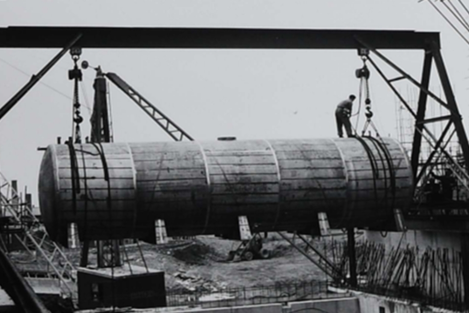 One of the old storage tanks being lifted into place in HALES during construction work in the 1950s.